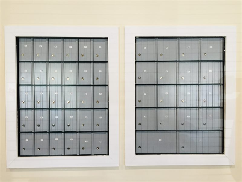 Wall of private locking mailboxes at Zipdesk, Centennial