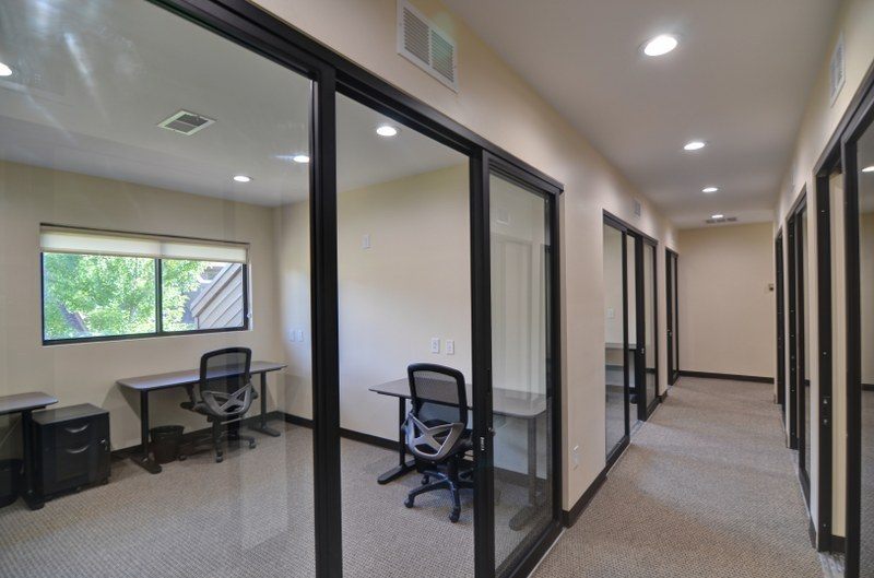 Row of glass-front private offices at Zipdesk