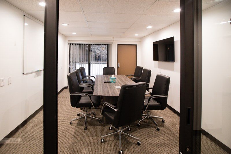 8-seat conference room with TV and whiteboard at Zipdesk